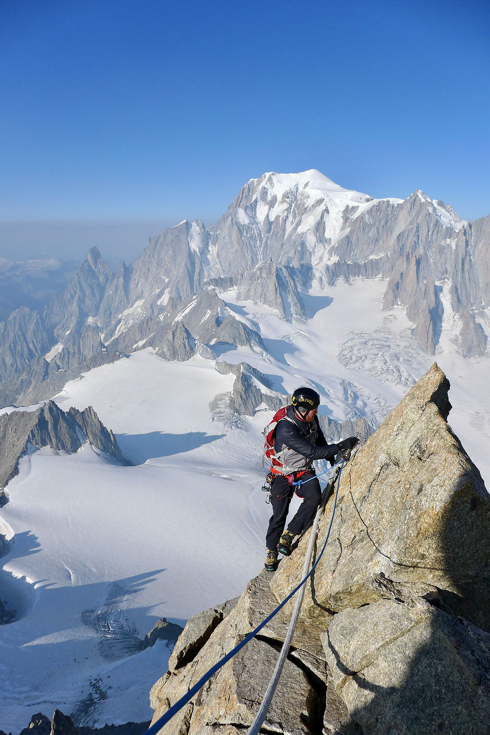 man with harness and rope, winter mountaineering in Scotland