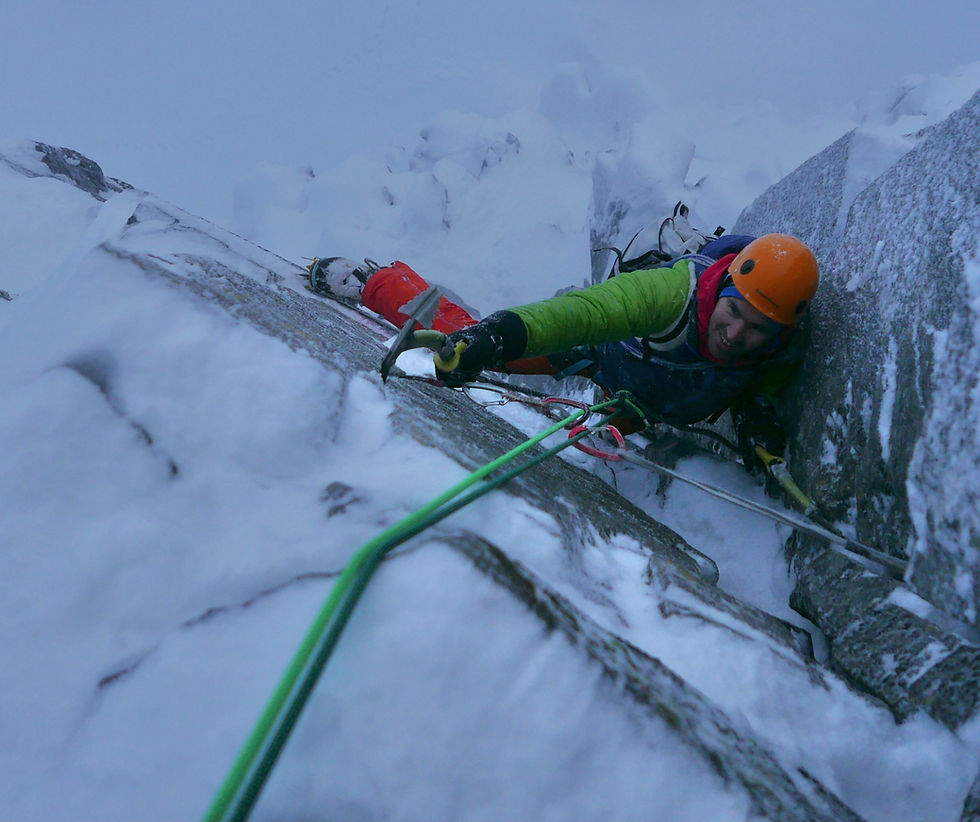 two climbers roped together on rock scramble in scotland