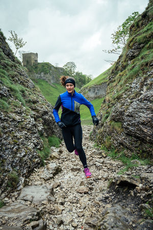 alt=“trail runner captured running in the Peak District during a still and video campaign for their Tech Gore-Tex Windstopper Jacket, filmed by JHP Visuals"