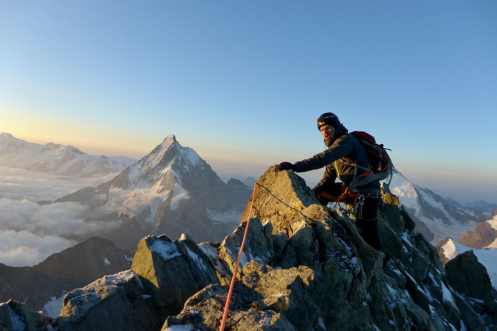 mountain guide climbing along ridge in apls