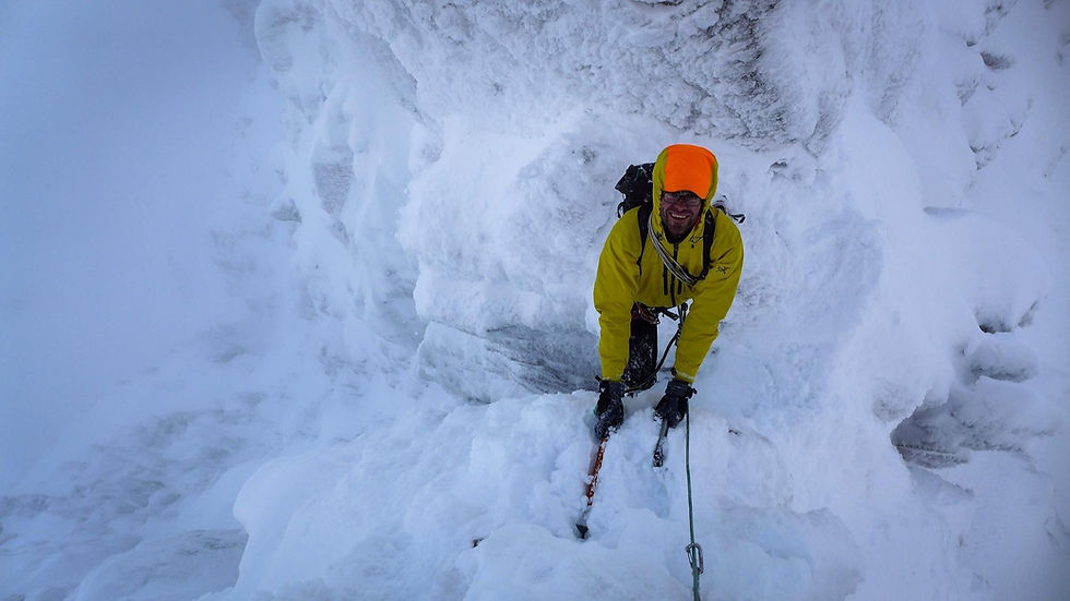 two men roped together on winter scramble in scotland