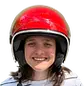 Portrait of a woman in a red Vespa helmet – representing customer Alena from the Czech Republic with her testimonial.