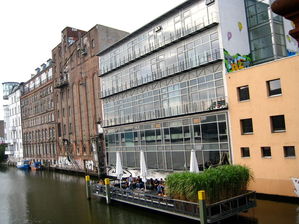 The Watergate nightclub building in Berlin seen from the Oberbaumbrücke, with its grid of windows facing the Spree