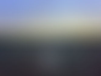 The old Tempelhof runway at dusk, its painted centre line running towards a low orange horizon