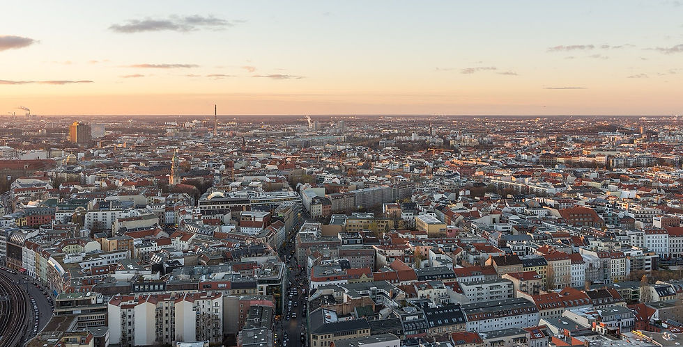 Wide open-air sunset panorama over Berlin seen from the Park Inn roof at Alexanderplatz