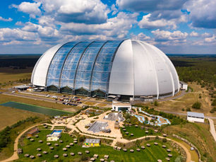 Aerial view of the Tropical Islands dome standing alone in the Brandenburg landscape