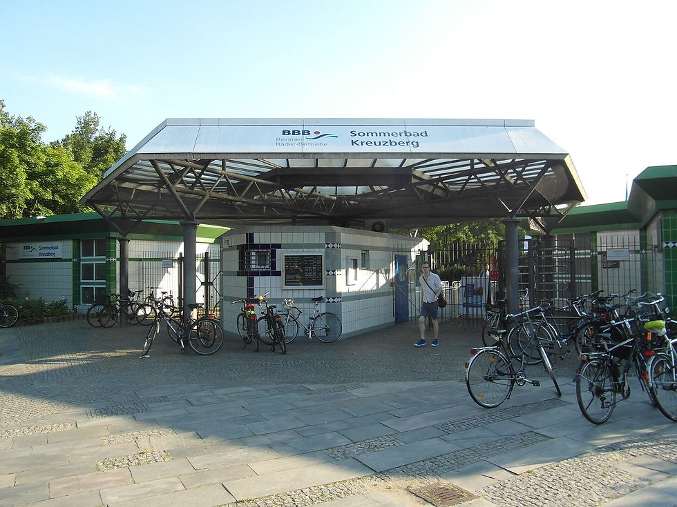 The entrance canopy of Sommerbad Kreuzberg with bicycles parked in front