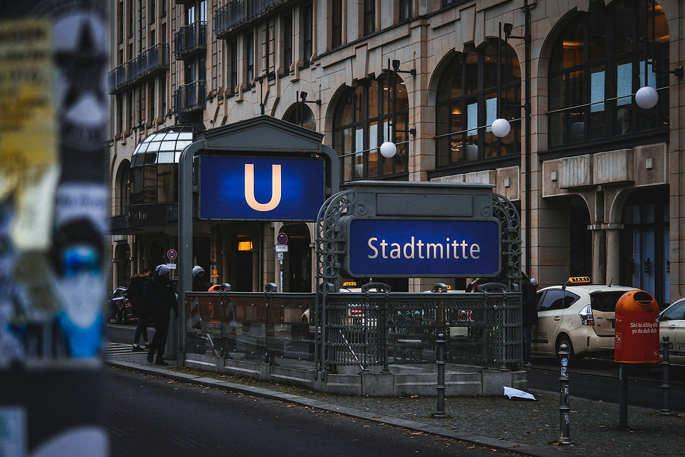 Berlin U-Bahn platform sign with yellow station styling and train information