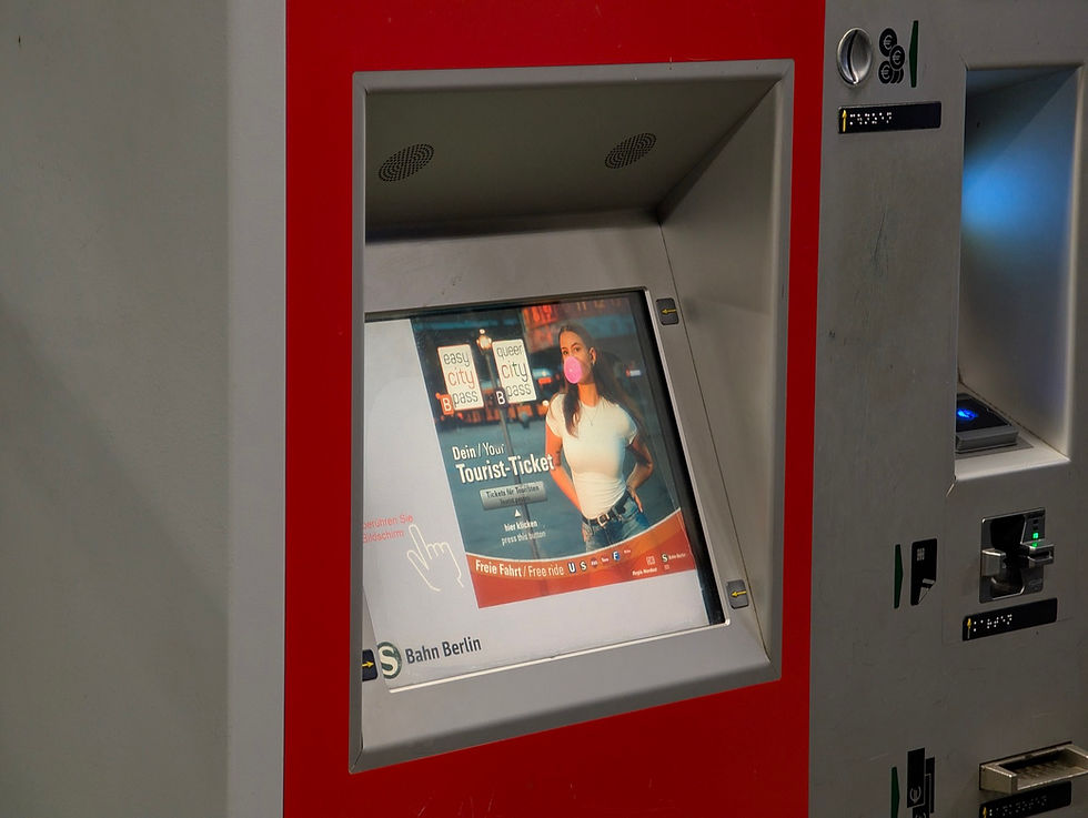 The touchscreen and coin and card slots of a red Berlin S-Bahn ticket machine