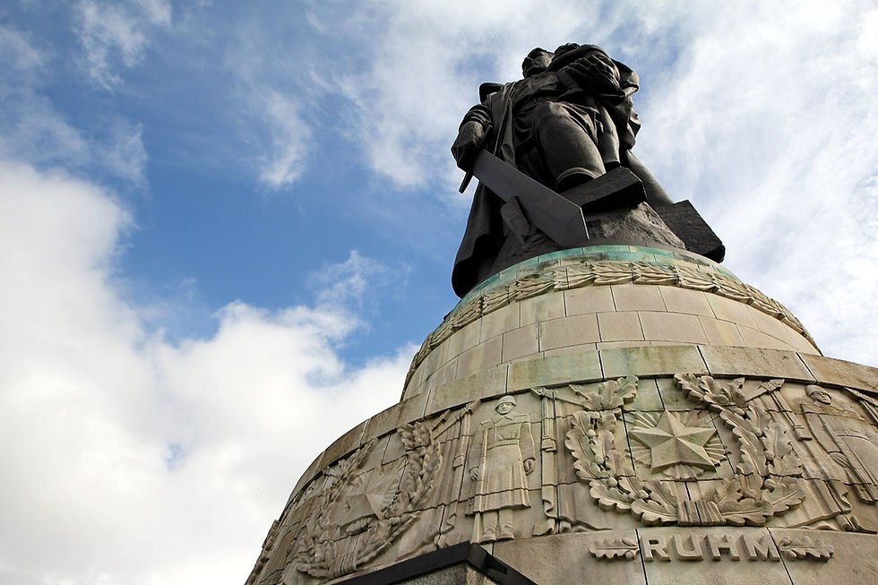 The 12 metre bronze soldier of the Soviet War Memorial on his rotunda, sword lowered, with carved reliefs and the word RUHM (Glory) below.