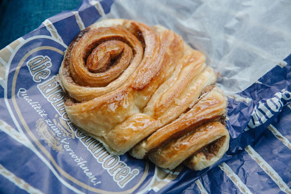 A Franzbrötchen cinnamon pastry on bakery paper