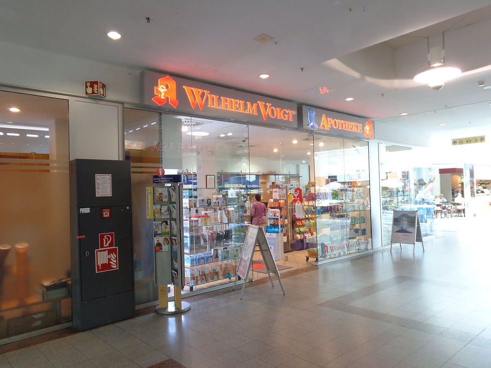 Wilhelm Voigt Apotheke pharmacy entrance inside a Berlin shopping area