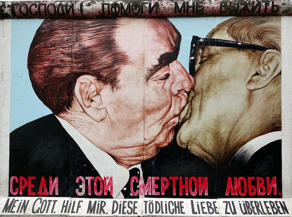 The "Fraternal Kiss" mural at the East Side Gallery in Berlin, showing Soviet leader Brezhnev and East German leader Honecker kissing, painted on a section of the Berlin Wall