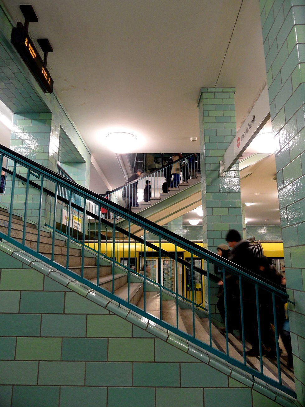 A busy crowd of people on a Berlin U-Bahn station platform