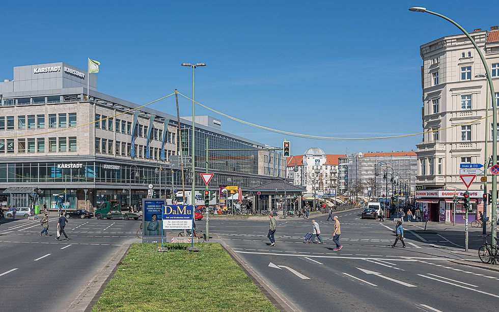 Hermannplatz square in Berlin-Neukölln with the Karstadt building and street traffic