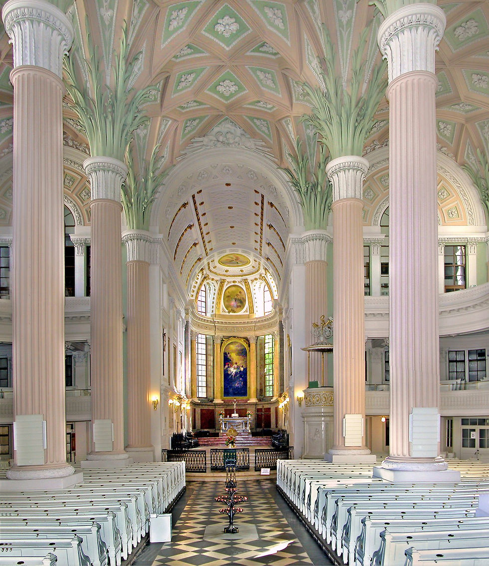 The nave of the Nikolaikirche in Leipzig with its pale palm-frond columns and coffered ceiling