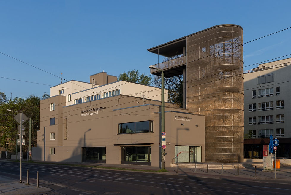 Preserved section of the Berlin Wall border strip with the documentation centre viewing tower on Bernauer Strasse.