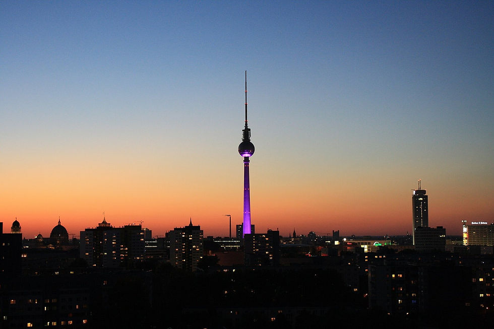 Berlin TV Tower lit at sunset, showing why timing and weather matter before booking a paid viewpoint