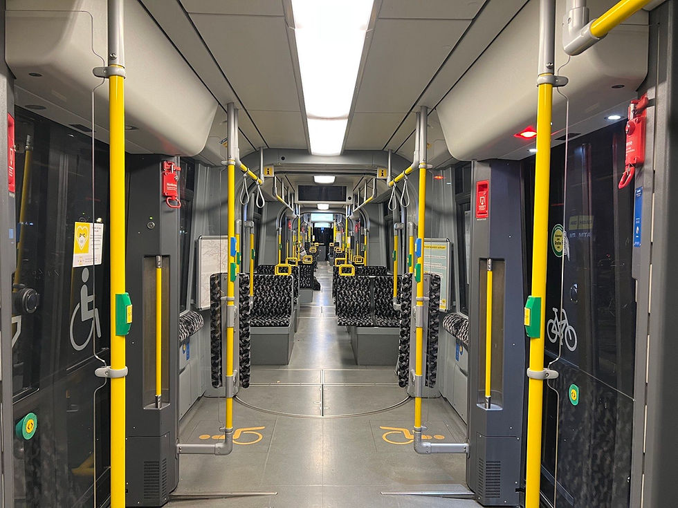 The bright interior of a modern Bombardier Flexity Berlin tram with open doors