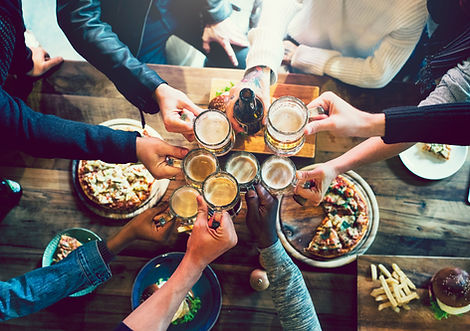 Cheering over table of food.jpg