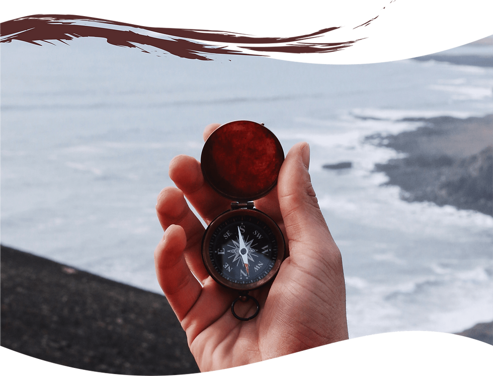 this is a photo of a person holding a compass, deciding which direction they want to go