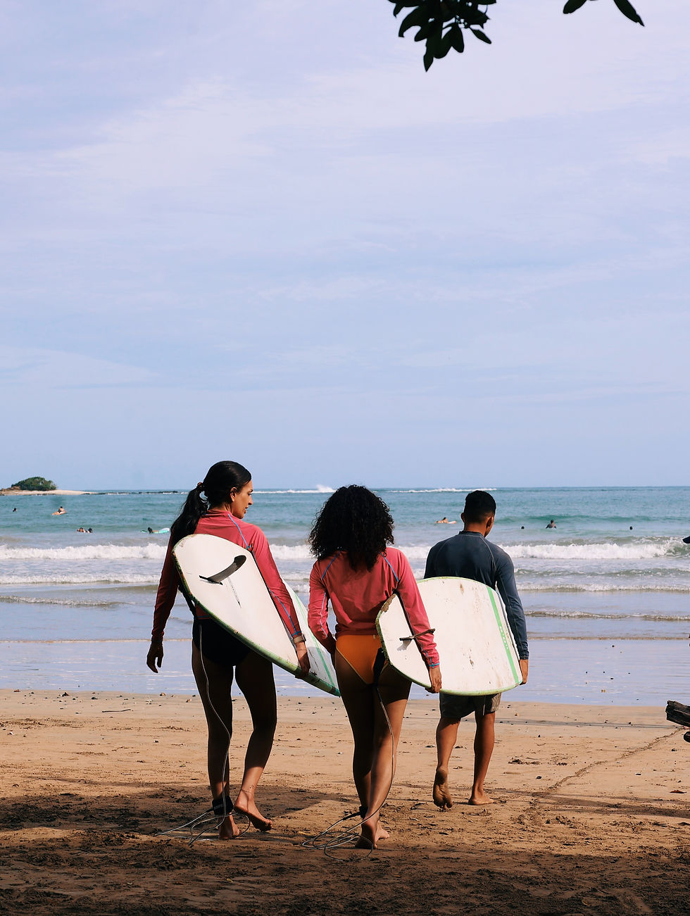 Group trip with solo travelers learning how to surf