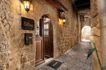 Casa Estiva entrance — medieval stone archway, GK Luxury Suites, Lysippou 4, Rhodes Old Town