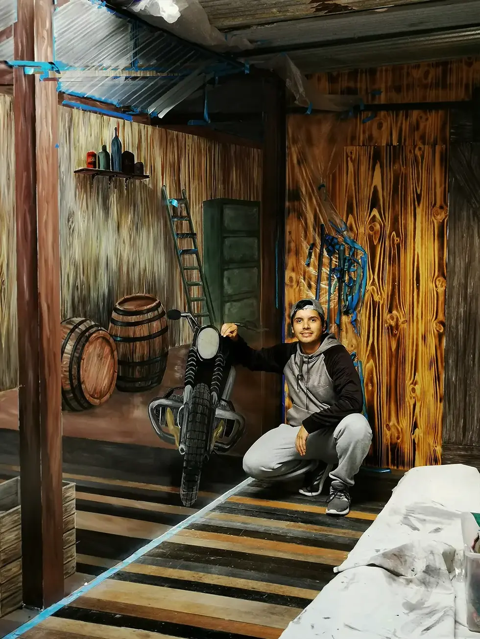 carlos next to bill mural