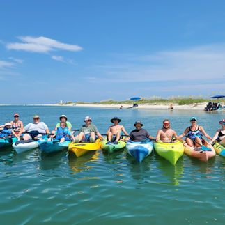 Family enjoying a sunny day kayaking in Cherry Grove