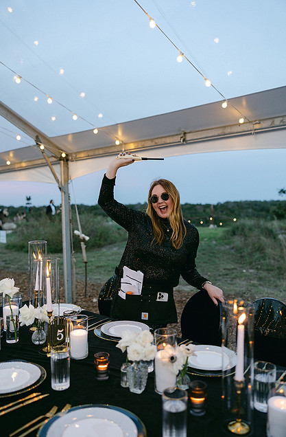 An Austin event planner having fun behind the scenes at a black tie wedding.