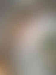 Refined wedding place setting with botanical plates, woven chargers, and custom guest name cards designed for a personalized guest experience