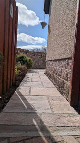 Handcrafted stone masonry wall with custom detailing