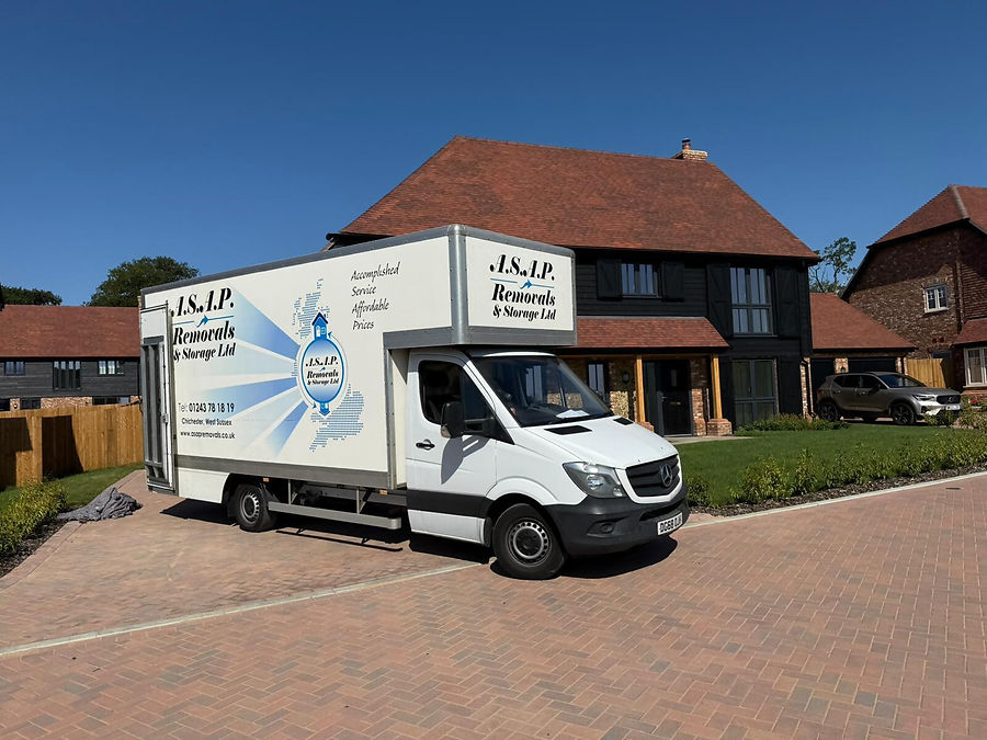 A.S.A.P. Removals moving truck parked in front of a residential house for home removal services.