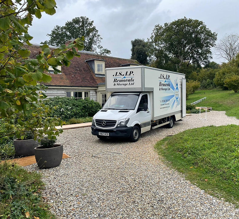 ASAP van on gravel driveway outside house