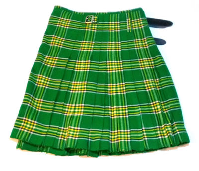 Bright green and yellow checked tartan kilt laid flat to display the pleated fabric pattern