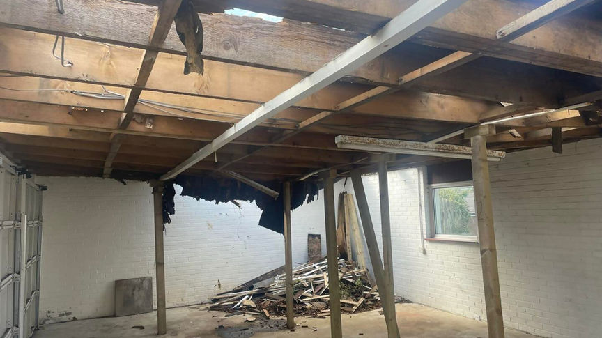exposed beams during a new flat roof installation