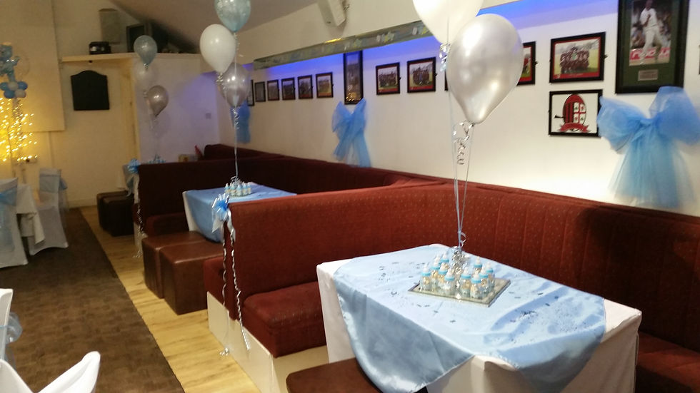 Interior view of social club hall decorated with balloons for event in Wembley
