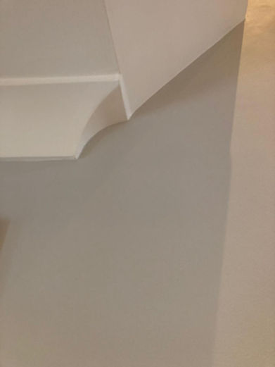 beige and white cornice, plastering work