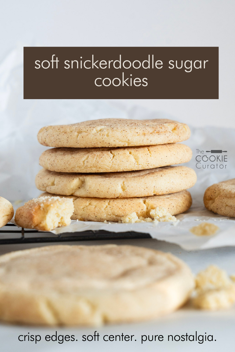 Close-up of soft snickerdoodle sugar cookies with golden edges, rolled in cinnamon sugar, cooling on a parchment-lined baking tray.
