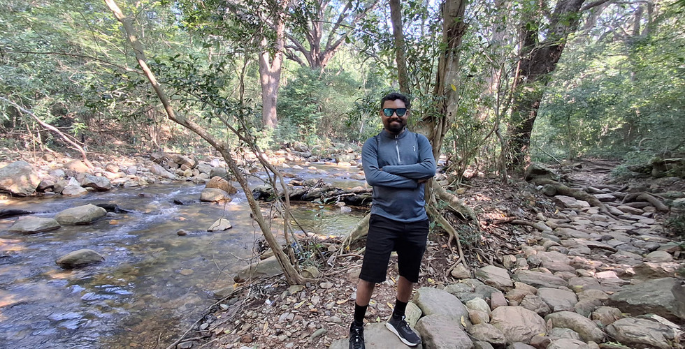 Mid trek break for photoshoot by the stream