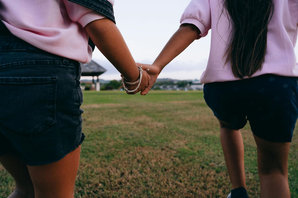 Two friends holding hands