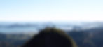 man on top of a mountain in new zealand