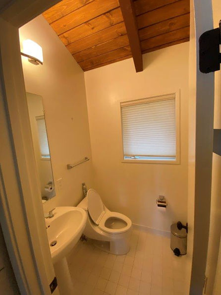 White bathroom with pedestal sink