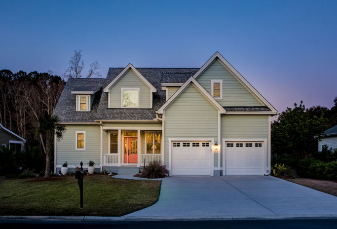 home-photo-source-real-estate-photography-front-elevation-of-beautiful-home-lit-up-at-twilight