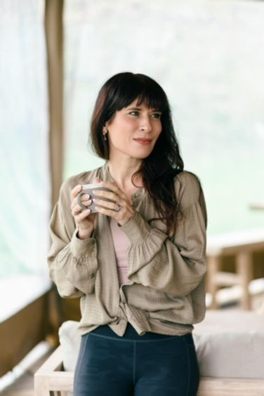 lady holding a mug of tea