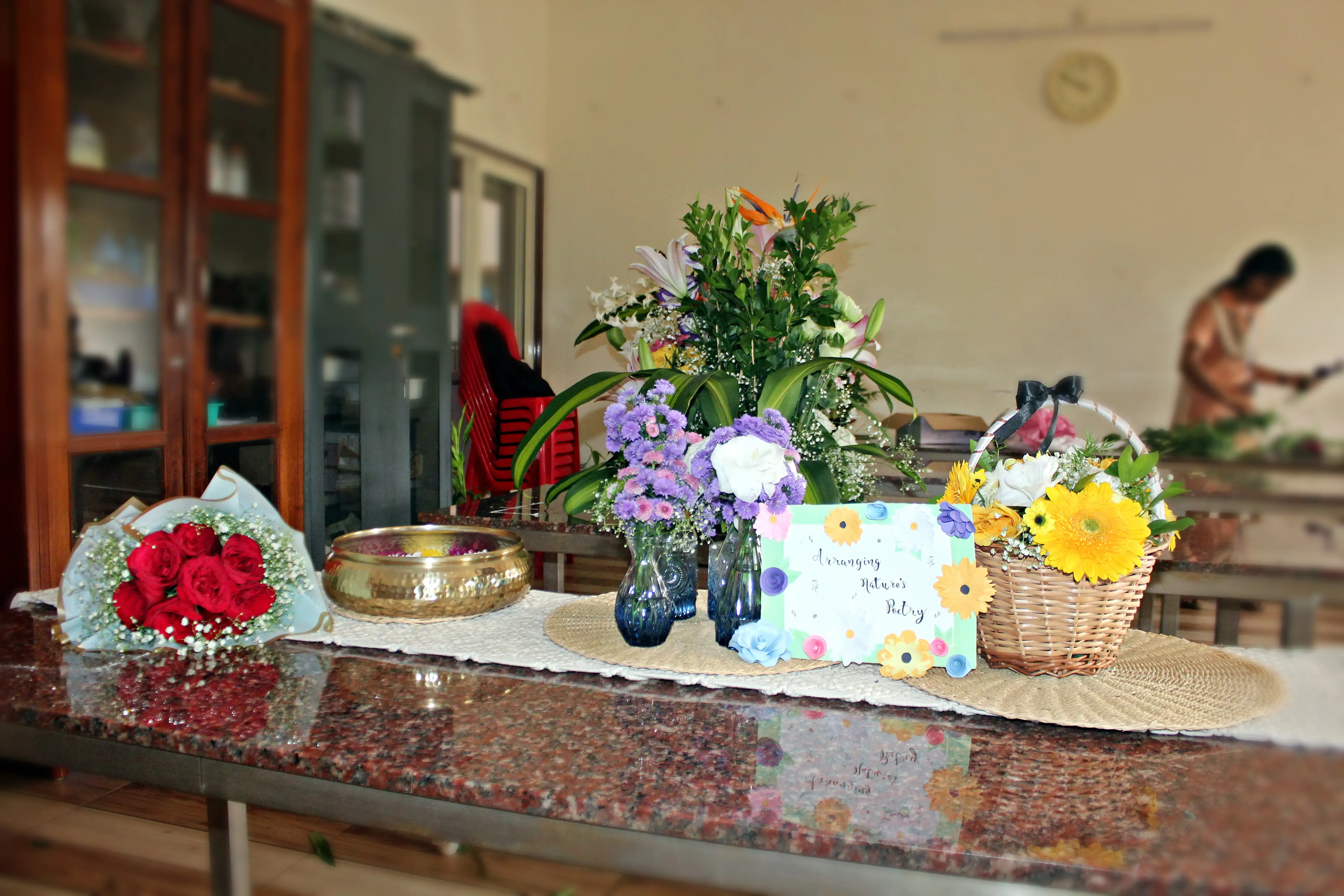 Colourful flowers arranged creatively by students