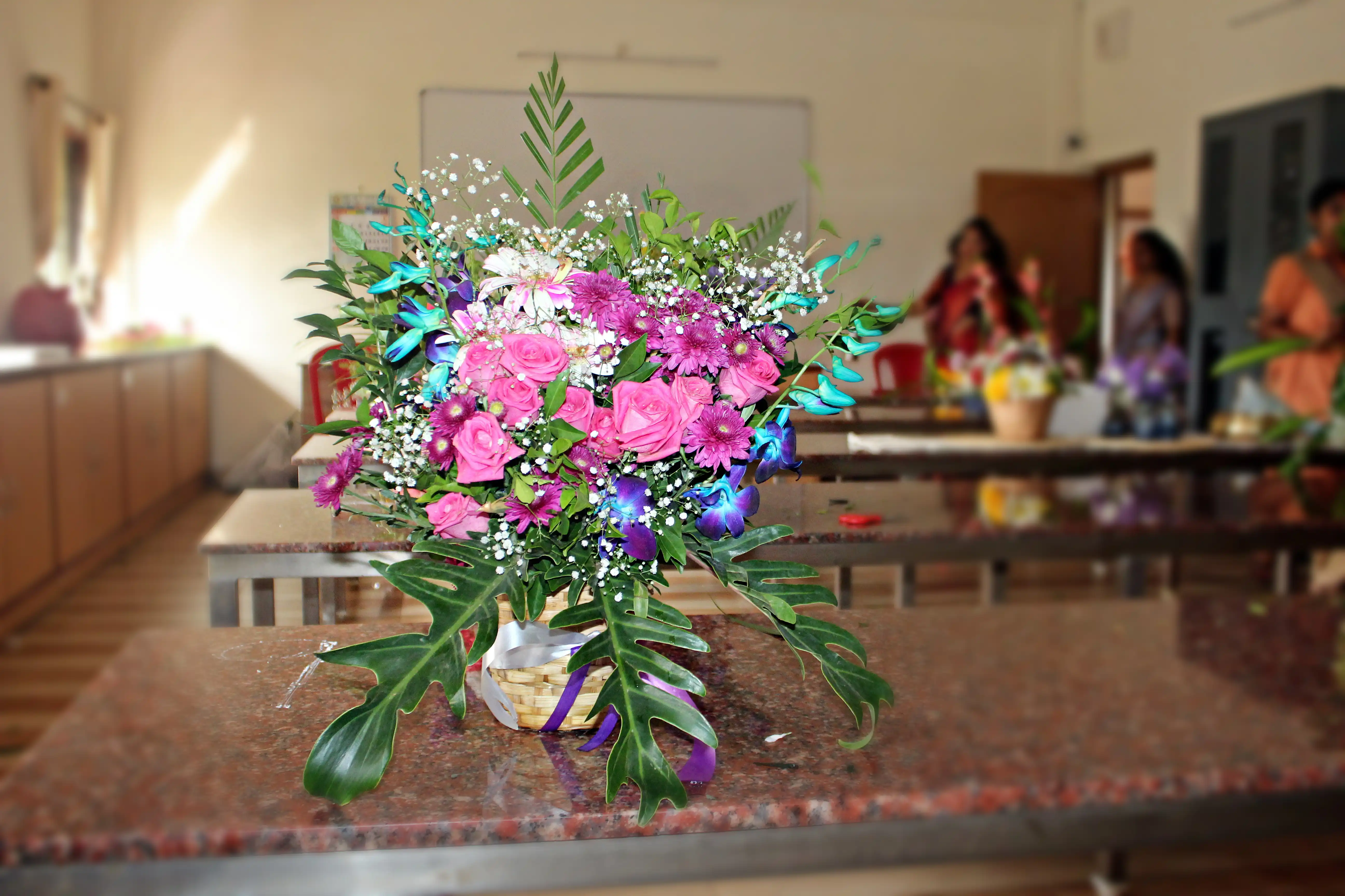 Colourful flowers arranged creatively by students