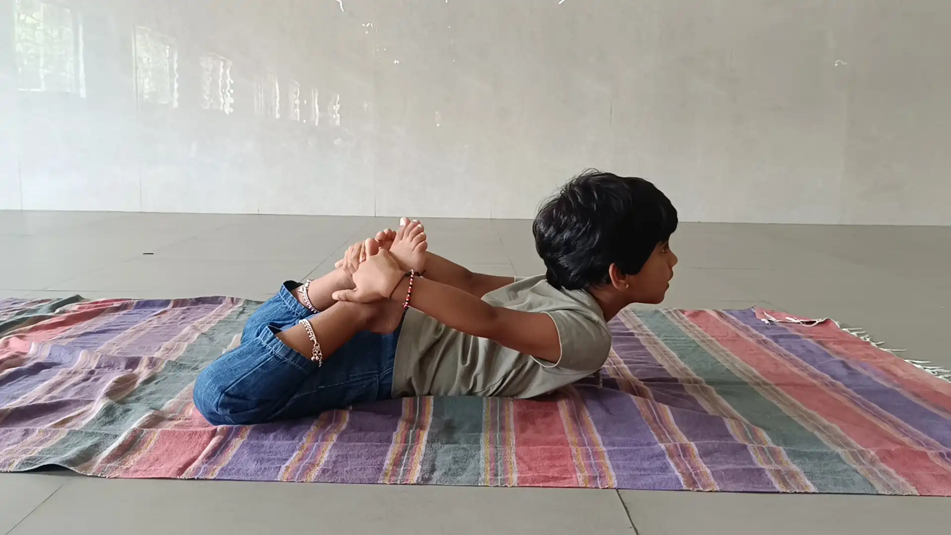 Children practicing yoga postures at Vidyodaya Public School