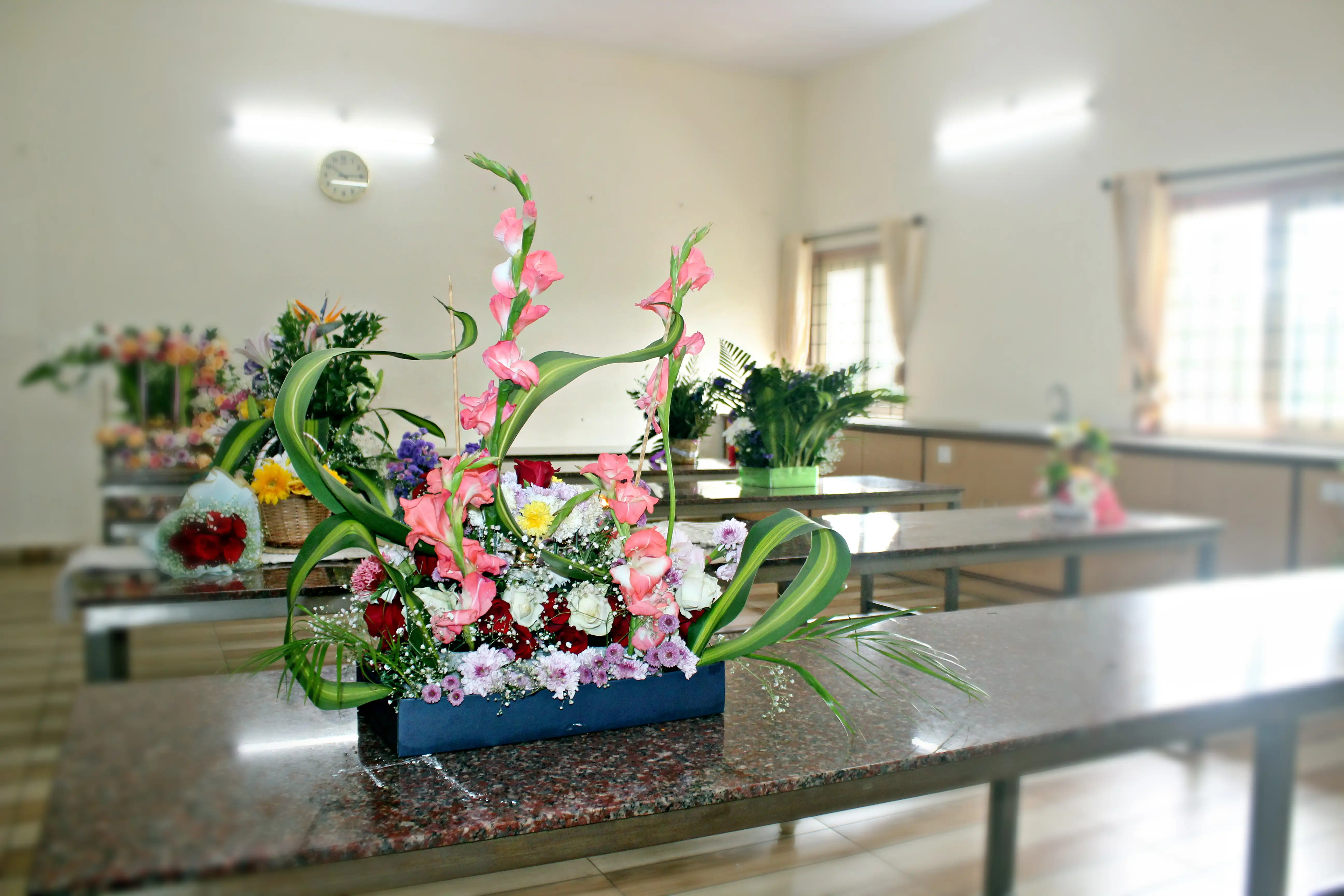 Colourful flowers arranged creatively by students