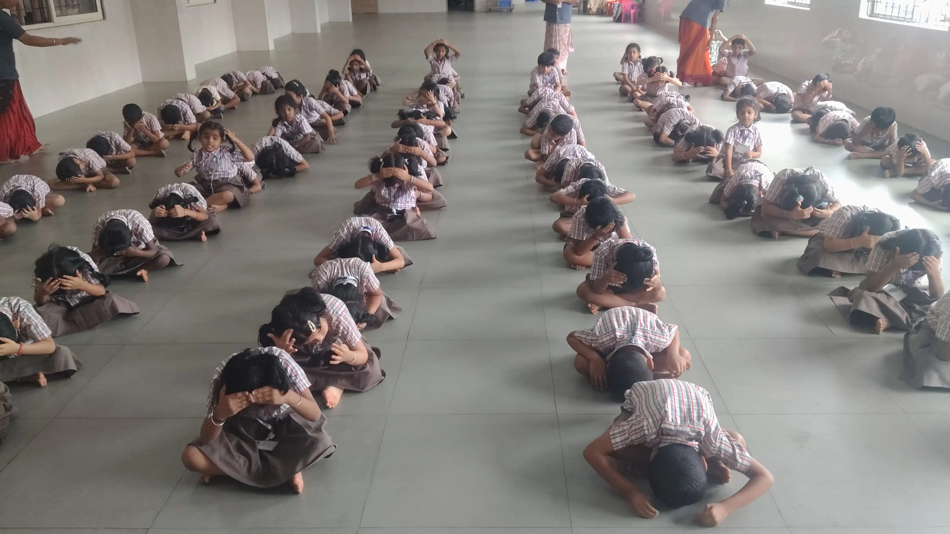 Children practicing yoga postures at Vidyodaya Public School